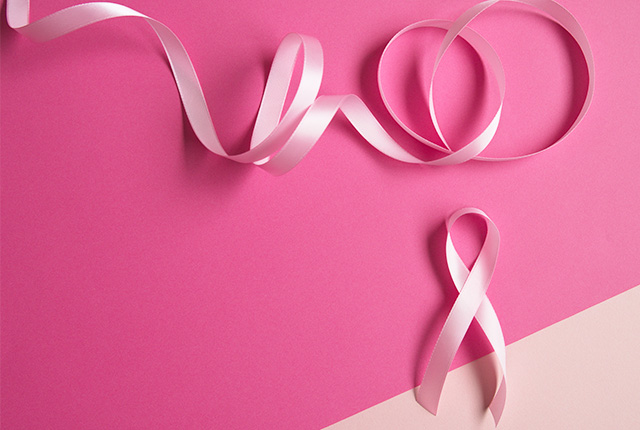 ピンクの背景に薄いピンクのリボン